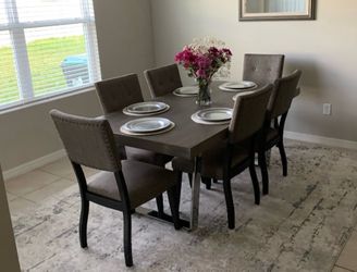 Dining Table Set with 6 Upholstered Chairs price negotiable