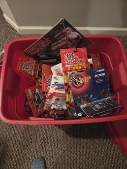 Nascar tub full of new cars in box.