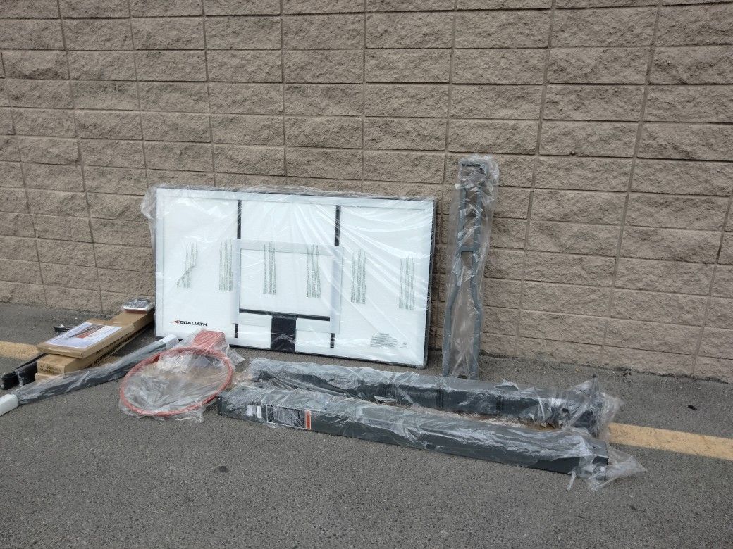 Goaliath 54 inch in ground basketball hoop, adjustable basketball court