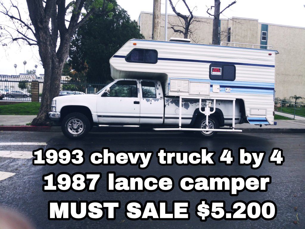 1993 Chevy pickup truck 4 x 4 extra cab with 1987 Lance camper truck got four brand new tires new brakes a lot of good stuff got salvage