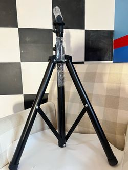 Metal tripod extends approximately 4 feet brand new