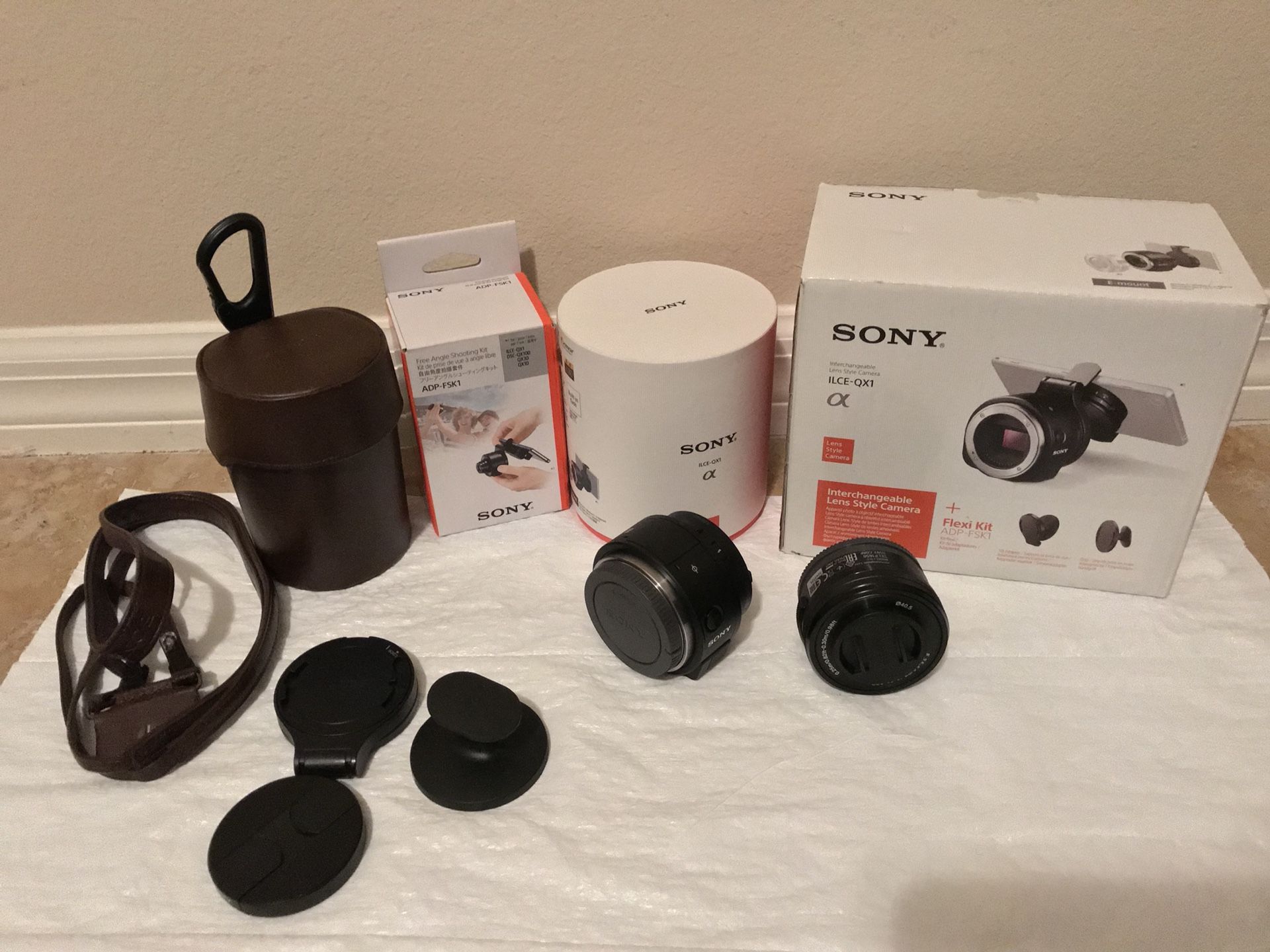 Sony ILCE-QX1 camera, with accessories