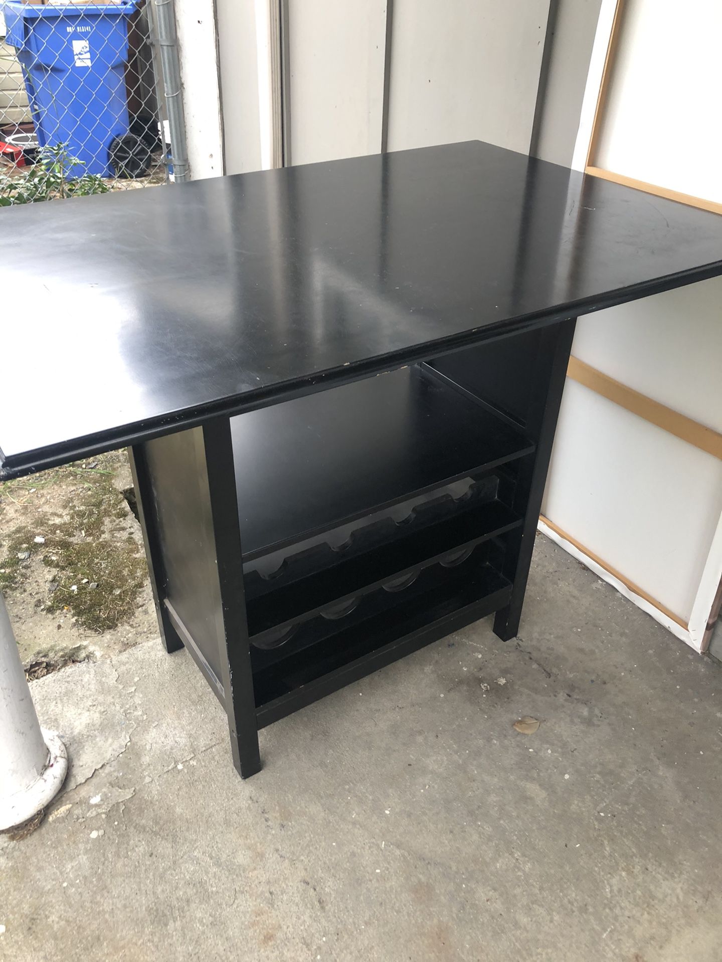 Pub height dining table with storage and four stools
