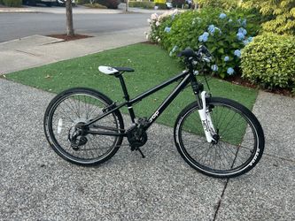 REI Co op Rev 24 kids bike