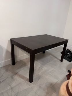 Dark brown extending dining table