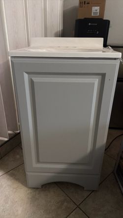 Bathroom sink and cabinet