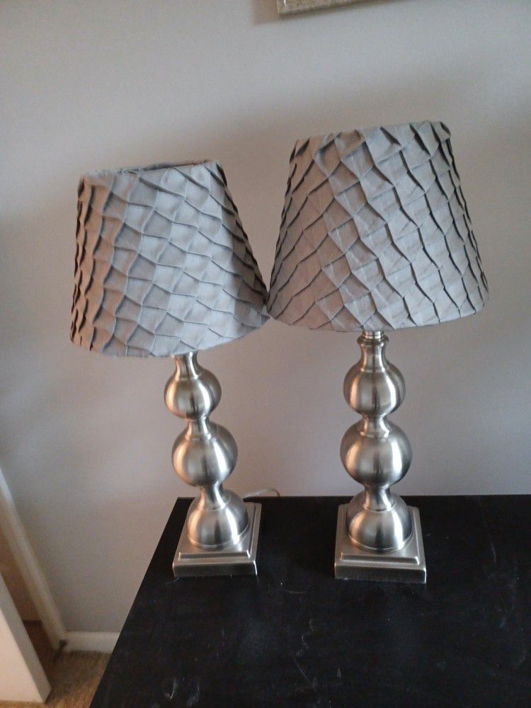 Pair of solid chrome lamps with shades