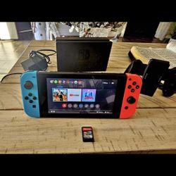 Nintendo Switch Comes With 1game And Tv Doc And All The Cords And Controllers 