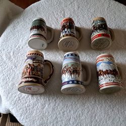 5 Budweiser, 1 Miller Beer Steins