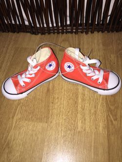 Orange high top converse