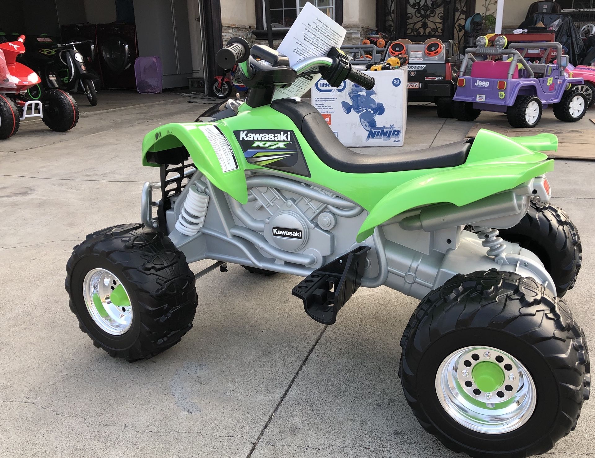 NEW CONDITION Green Kawasaki KFX 12volt electric kids ride on cars