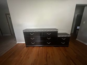 black dresser and nightstand