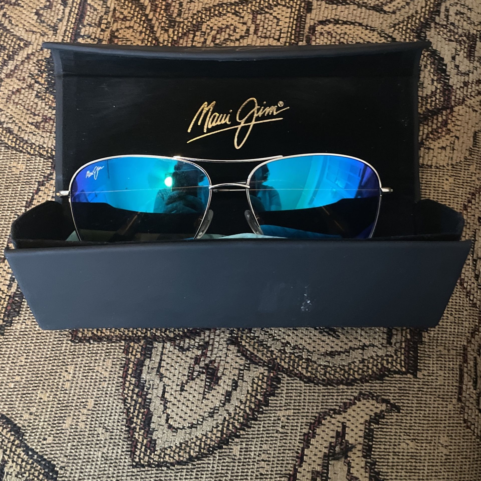 MAUI JIM’S BLUE POLARIZED GLASSES