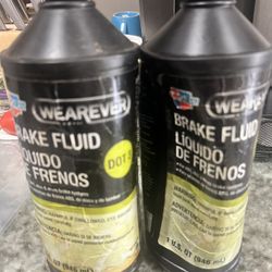 Two Bottles Of Brake Fluid- One Full, One 1/2 Full