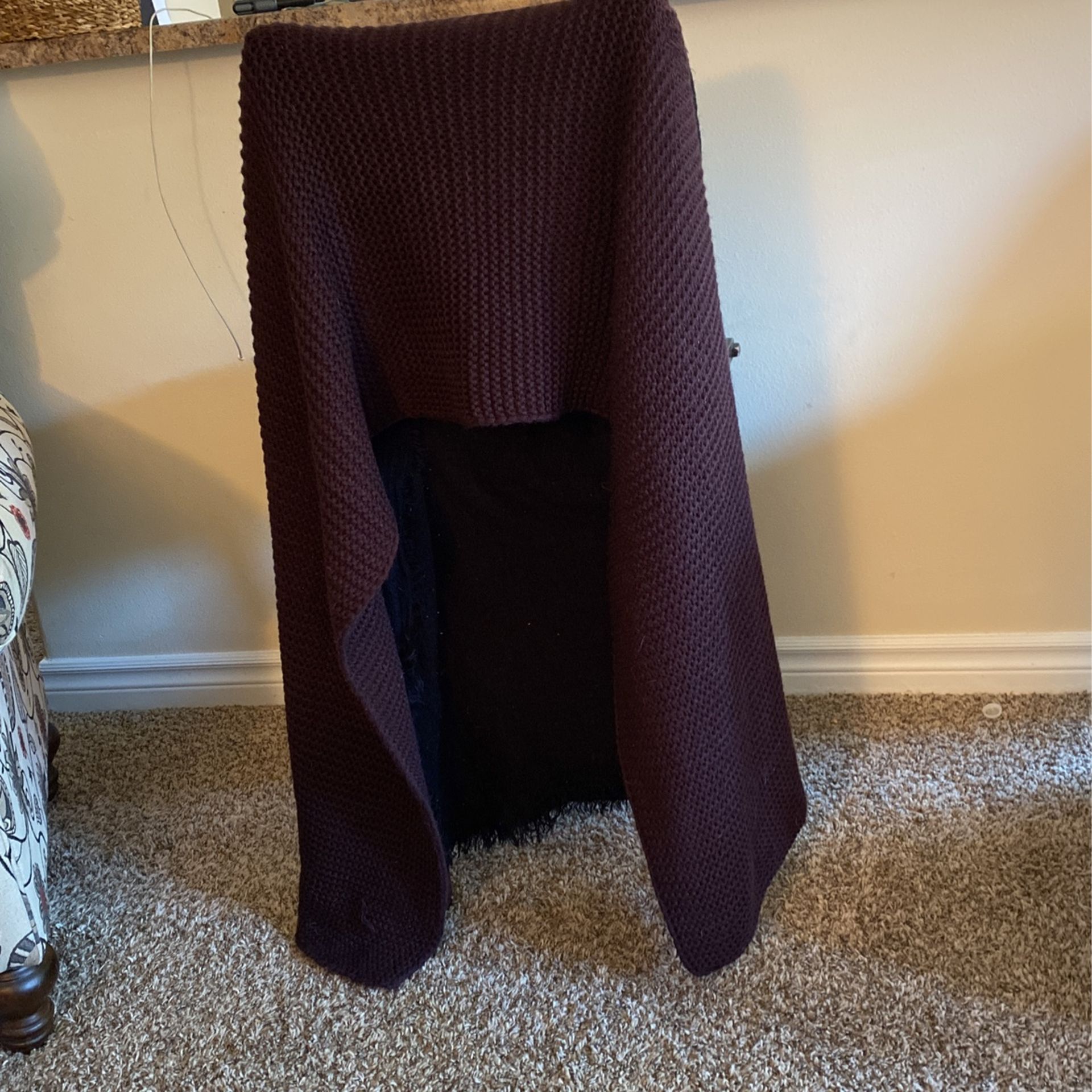 Purple Scarf That Is Extremely Long And Wide. It’s A Beautiful Part Of A Fashion Statement Or You Can Just Use It To Keep Yourself Warm.