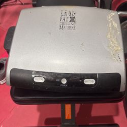 Lean mean fat reducing grilling machine