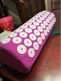 Purple acupuncture pillow.