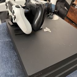 PS4 Pro with 2 controllers & charging dock