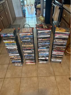 Massive 150+ dvd movie collection with 4 metal storage towers