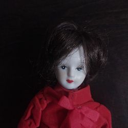 Vintage (J.S.N.Y).  Porcelain Doll In Red Velvet Dress