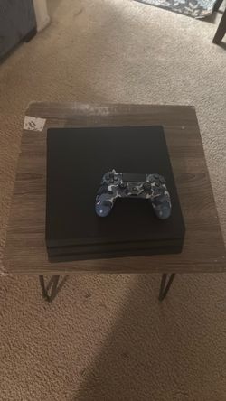 A ps4 pro with the controller, and the cables and everything