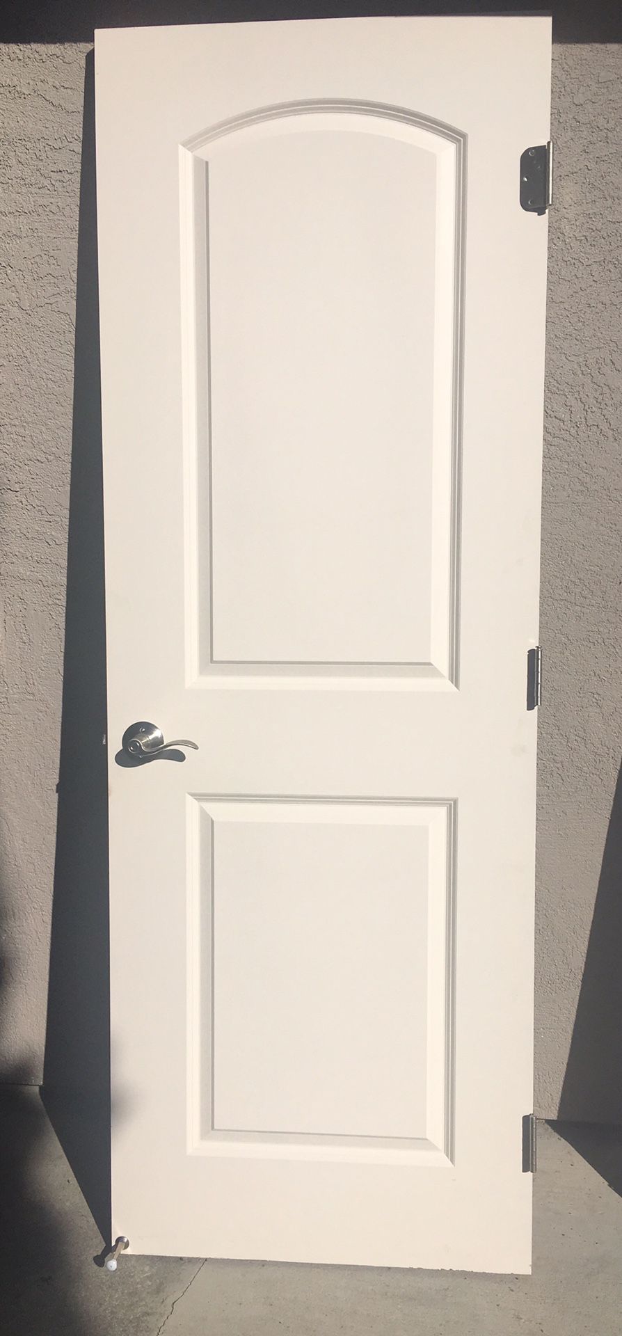 White paneled door with chrome door handle 79x28”