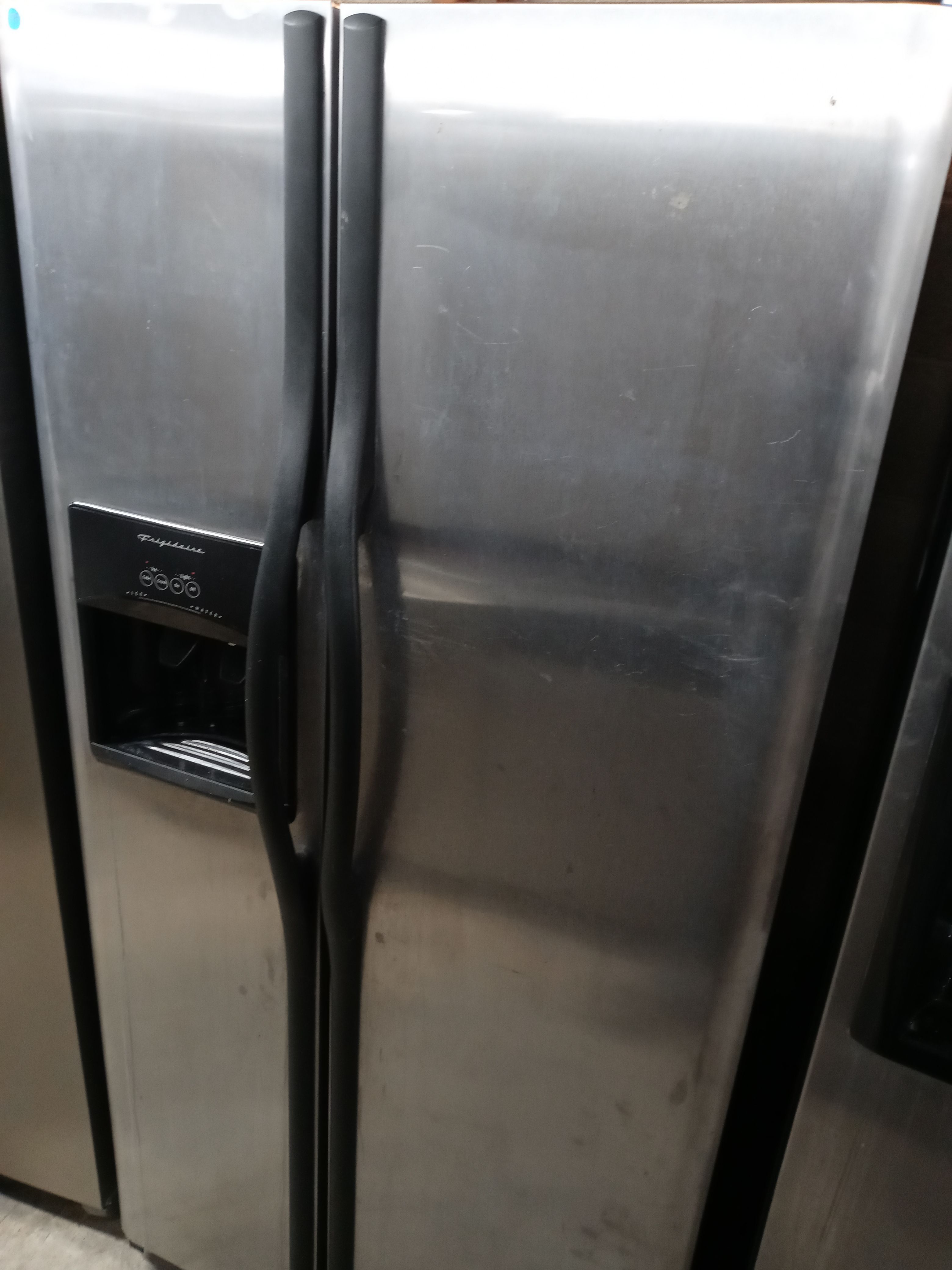 Frigidaire stainless steel side by side refrigerator (missing freezer drawer) - Free delivery