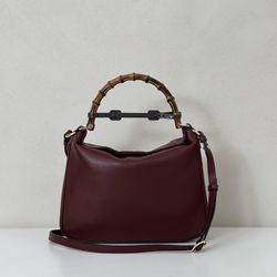 A wine-colored handbag