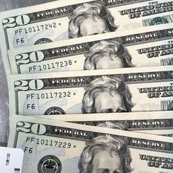 20 Dollar Bills In Numerical Oder With Stars On The 