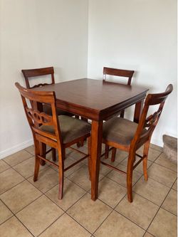 Cherry wood high top table and 4 chairs