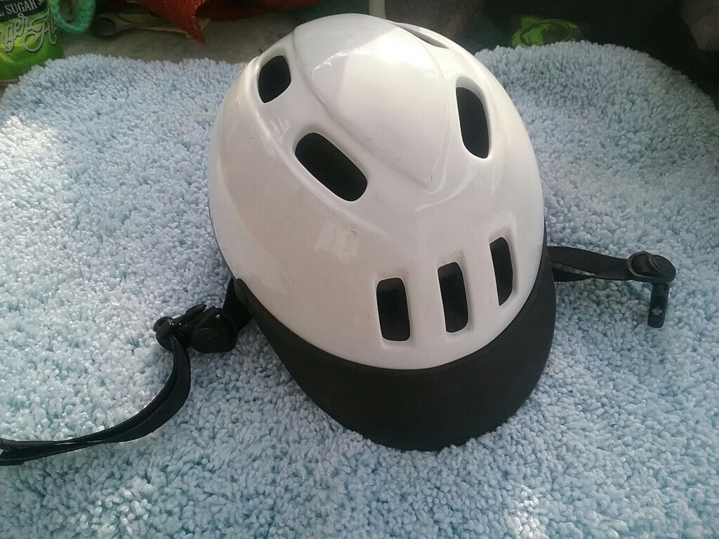 Several horse riding helmets different colors & sizes