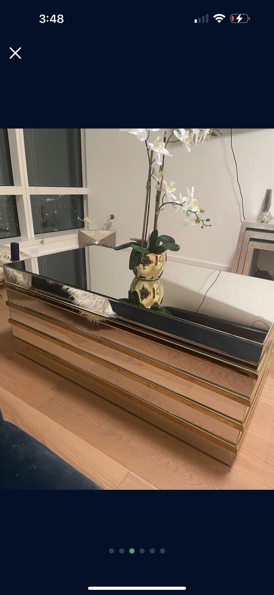 Mirrored coffee table with gold trim