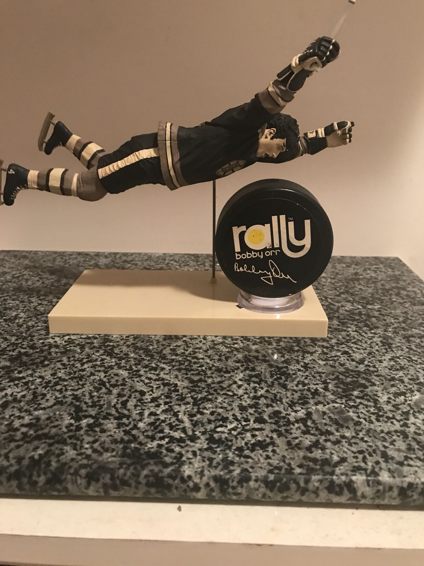 The flying Orr figure with very rare Rally Bobby Orr Puck