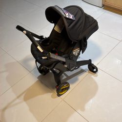 Doona Car Seat And Stroller + Base And Extra