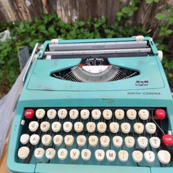 Vintage Smith Corona Couger '60s portable typewriter. Turquoise blue is a period color. Perfect for display or sitting in your favorite Go-Go Cafe.