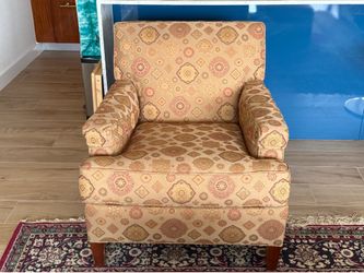 Two Ethan Allen arm chairs.
