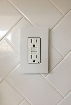 GFI install festooned lighting fixtures receptacle replacement flickering lights panel upgrades main breaker car chargers code violations