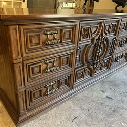 Long solid wood dresser for sale with a unique and elegant carved design.