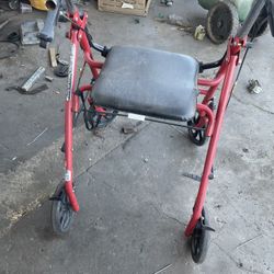 red Drive Medical 4-Wheel Rollator walker with a seat.