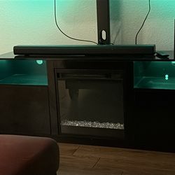 75” smart tv & all black tv stand built in fire place & job subwoofer & sound bar