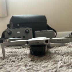 DJI Mini 2 With Controller Chargers And Batteries.