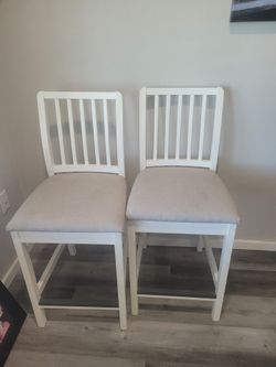 OBO - IKEA EKEDALEN bar stools in a clean white and light gray finish.