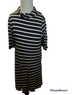 Long sleeve long black and white striped dress.