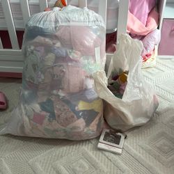 Bag Of Girls Clothes, Bows And Ornament