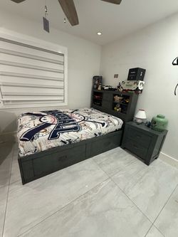 Full bed with nightstand from El Dorado Furniture. In excellent condition. MATTRESS NOT INCLUDED. The bed has four large drawers, two on each side.