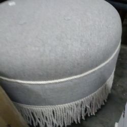 Beautiful Round Heather Gray Ottoman With White Fringe 