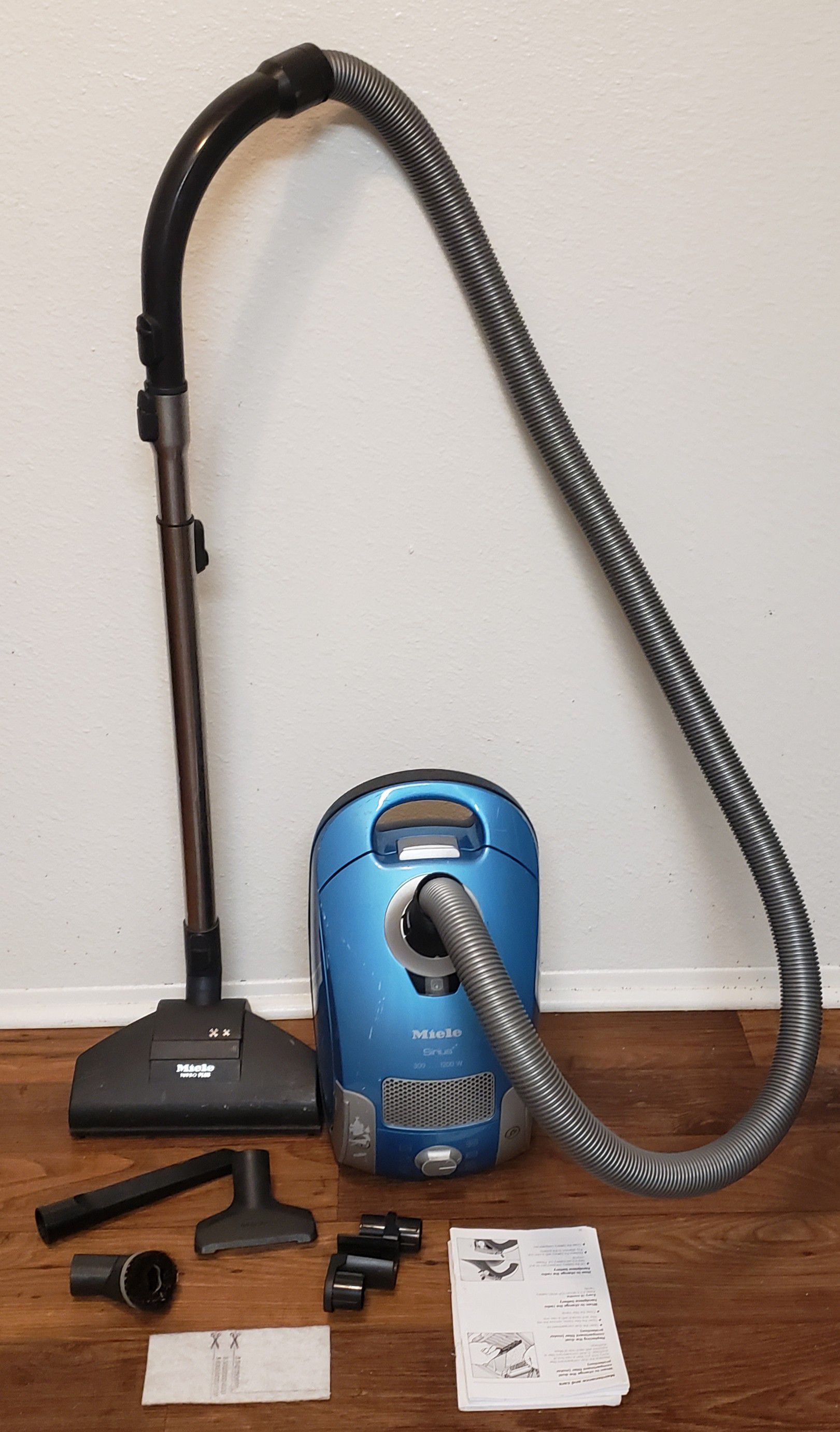 Miele canister vacuum with attachments