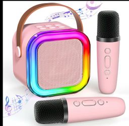 New pink mini karaoke machine with two microphones