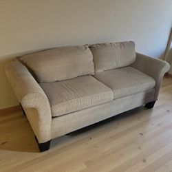 Beige Corduroy  90” sofa with cushion protector. Good condition.