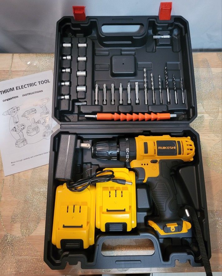 NEW RUIKESHI Lithium Cordless Hammer Drill Set in a hard case